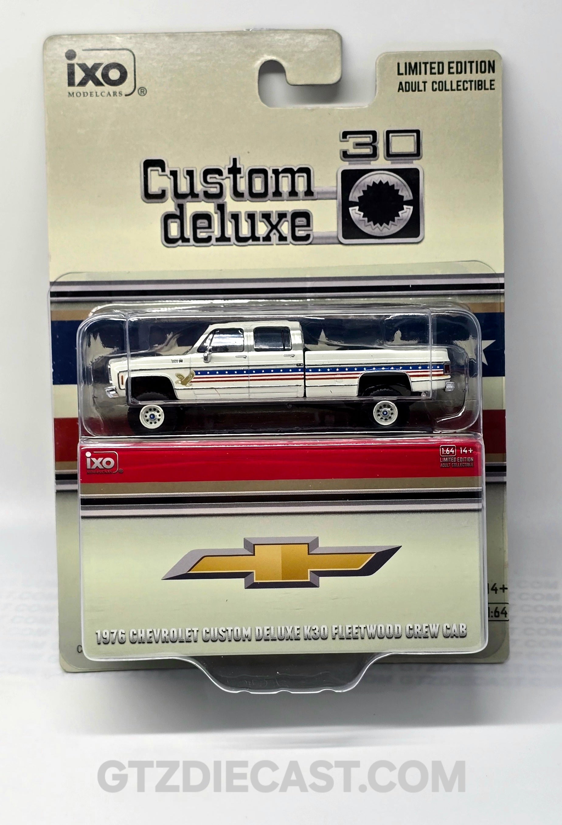 IXO Model 1:64 1976 Chevrolet Custom Deluxe K30 Fleetside 250th Anniversary Edition – White